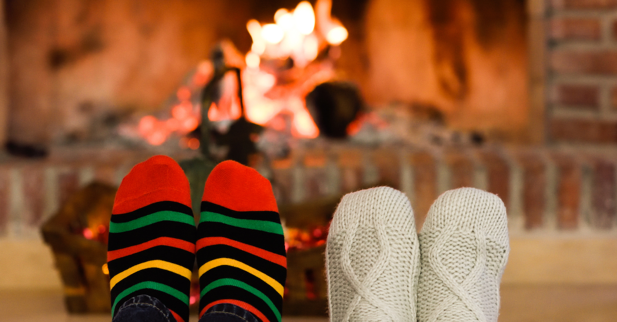 feet-christmas-socks-near-fireplace
