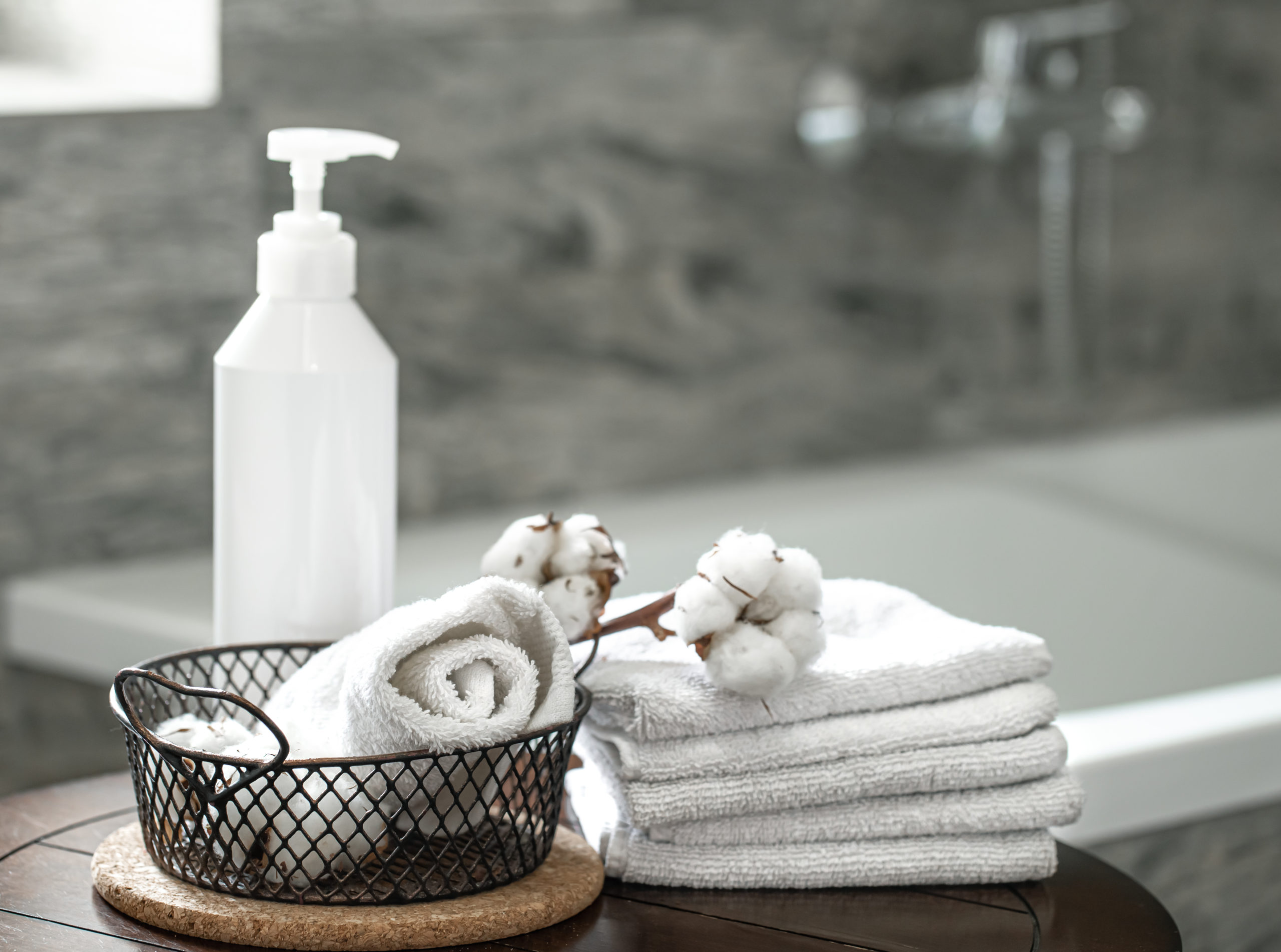 blurred-bathroom-interior-set-clean-folded-towels-copy-space-hygiene-health-concept-scaled