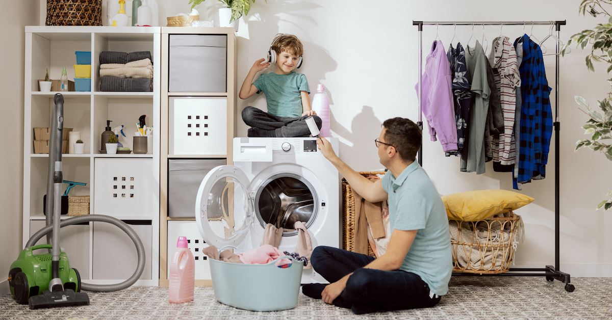father-son-are-putting-clothes-wash-small-child-sits-washing-machine-helping-dad