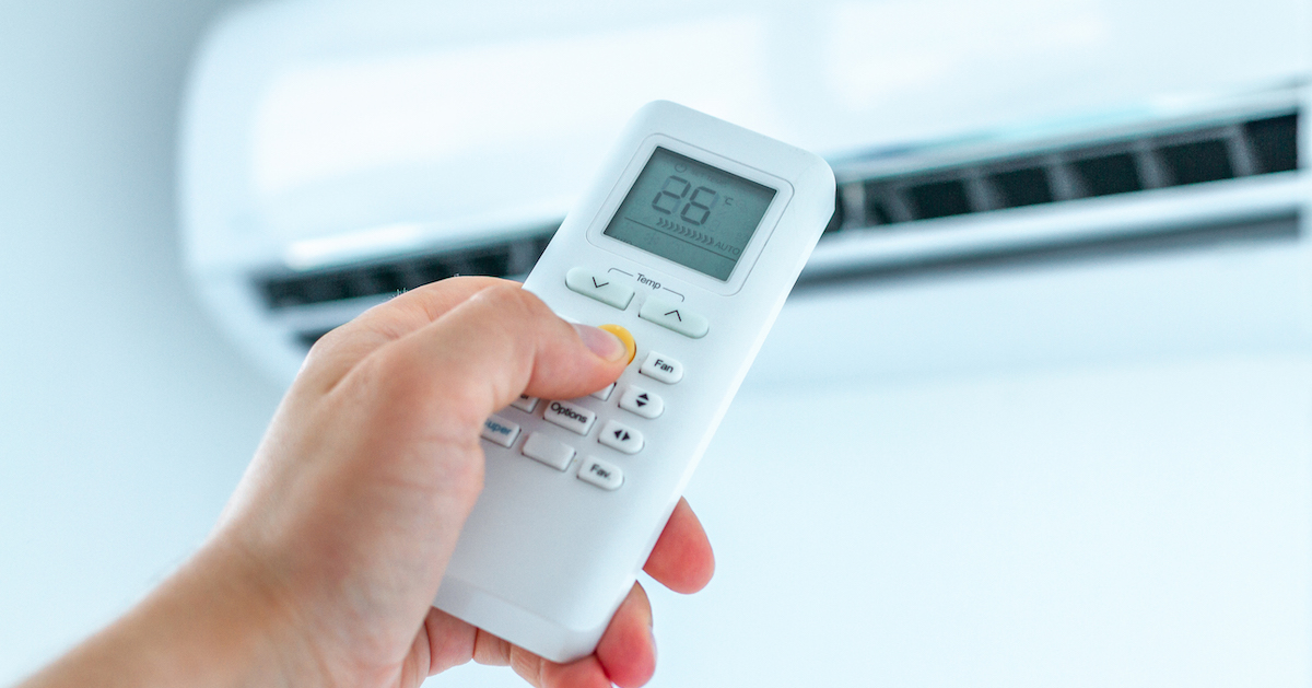 air-conditioner-temperature-adjustment-with-remote-controller-room-home