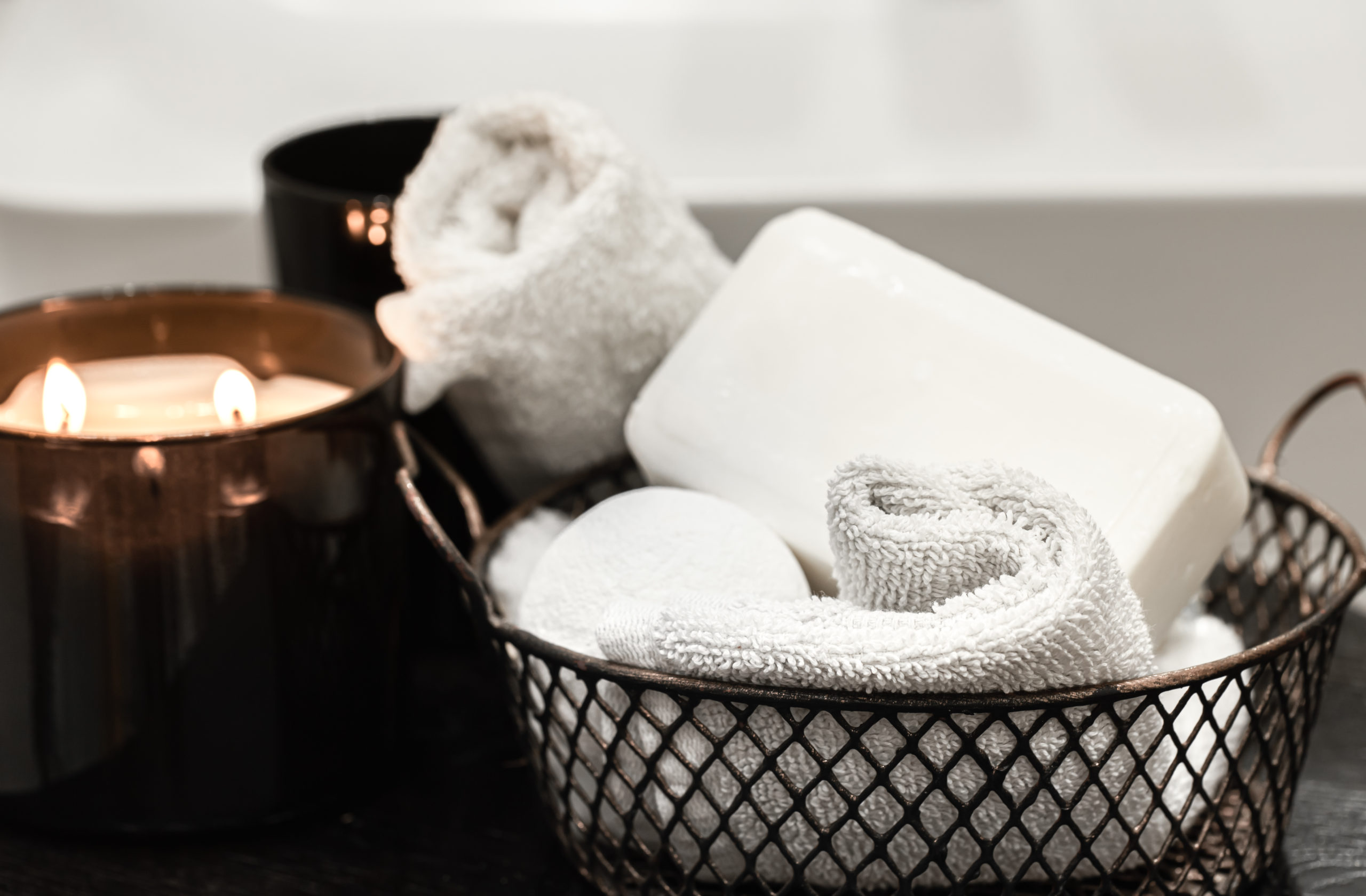 bath-accessories-burning-candle-body-care-hygiene-concept-scaled